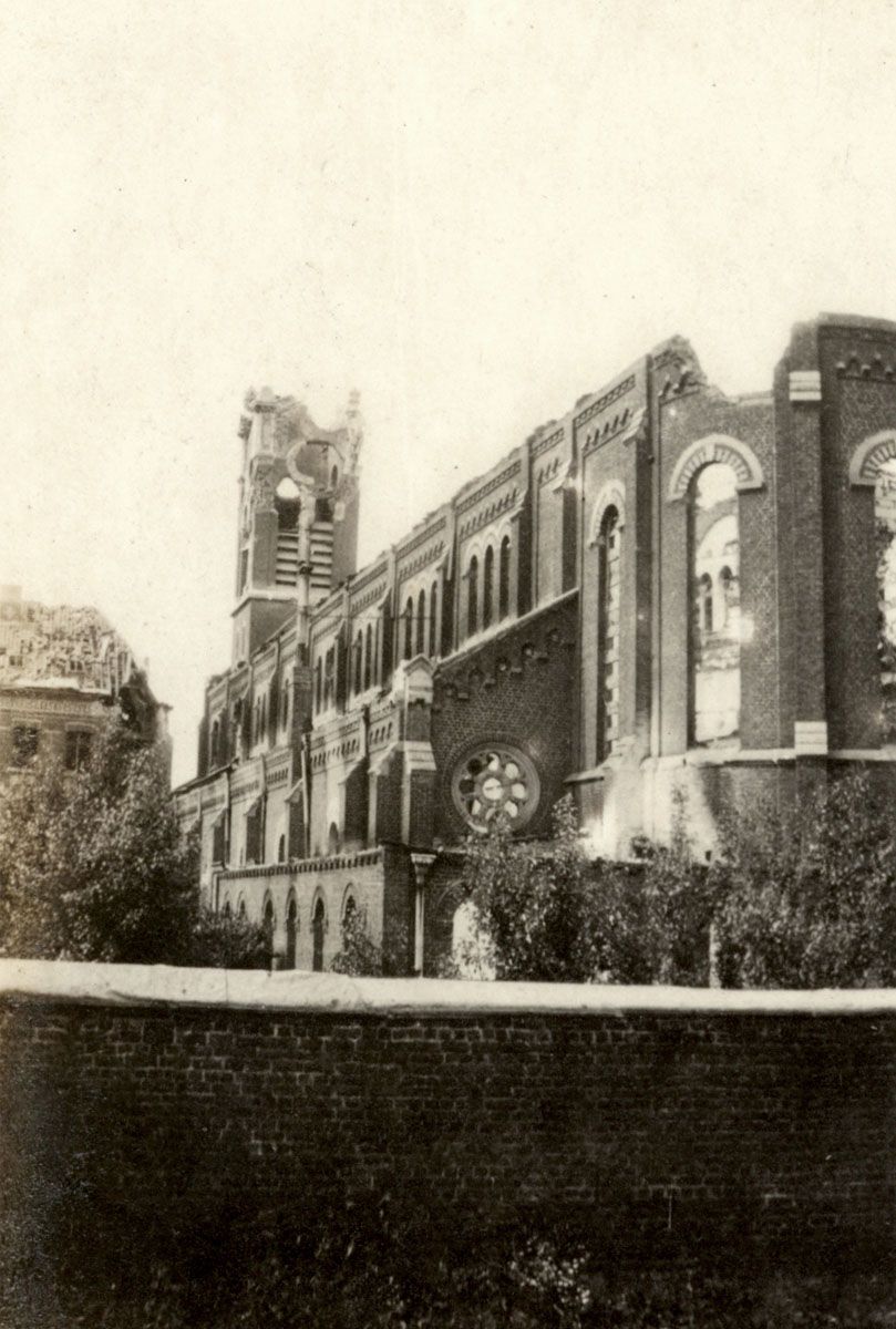The exterior of a church, severely damaged by artillery, Armentières, 1916